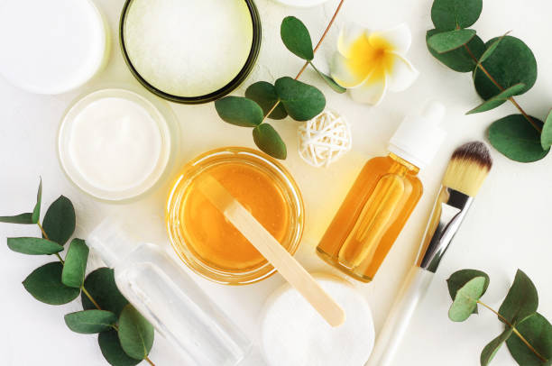 Top view bottles with facial treatment product white background.